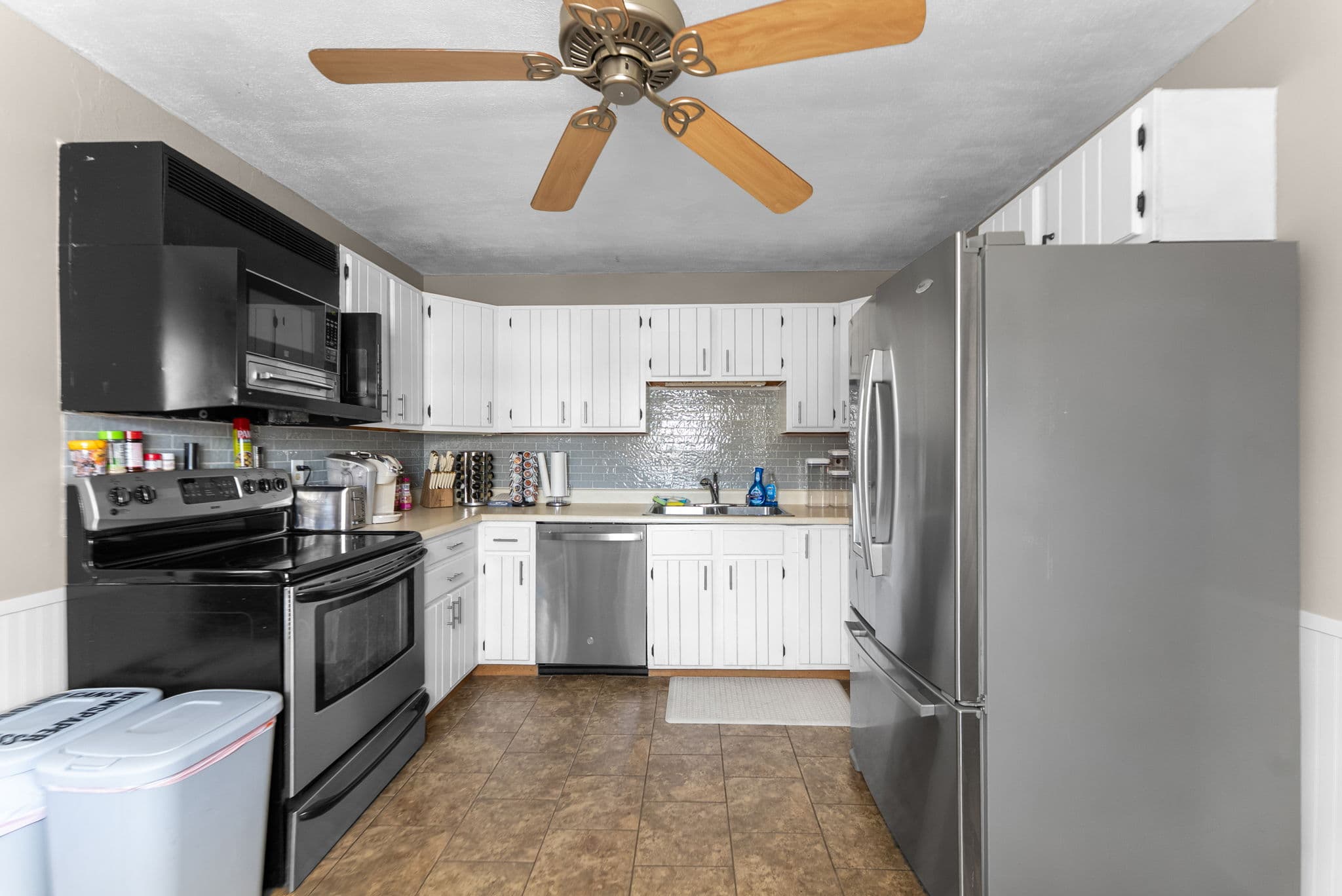 Full kitchen with stainless steel appliances